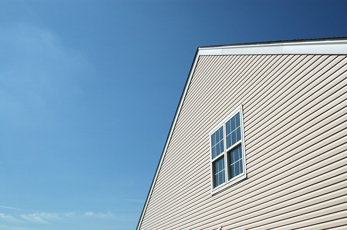 A house with a blue sky in the background