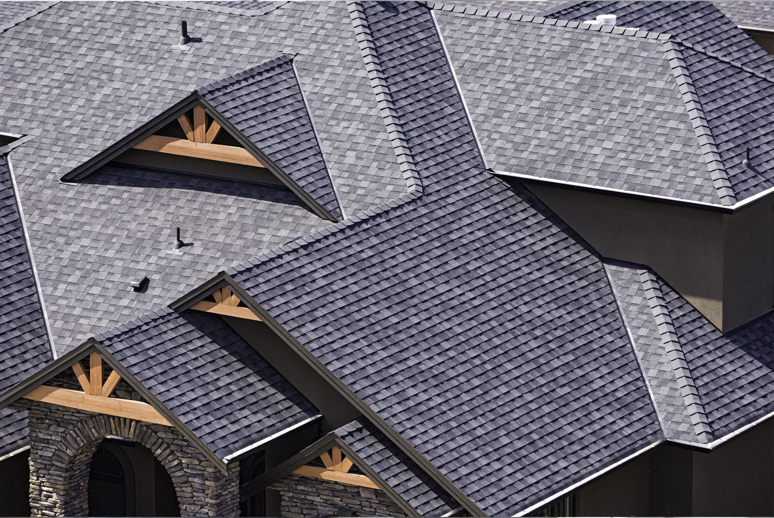 A close up of some houses with their roofs